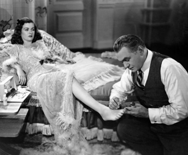 Artist Edward G. Robinson painting Joan Bennett's toes in "Scarlet Street."