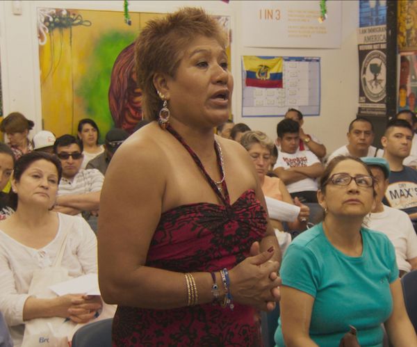 woman relates her story of coming to the US at a Make the Road New York immigration support group in Frederick Wiseman’s IN JACKSON HEIGHTS. Photo: Zipporah Films.