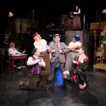 Tony Castellanos as Wilson Mizner, with cast of "Road Show."